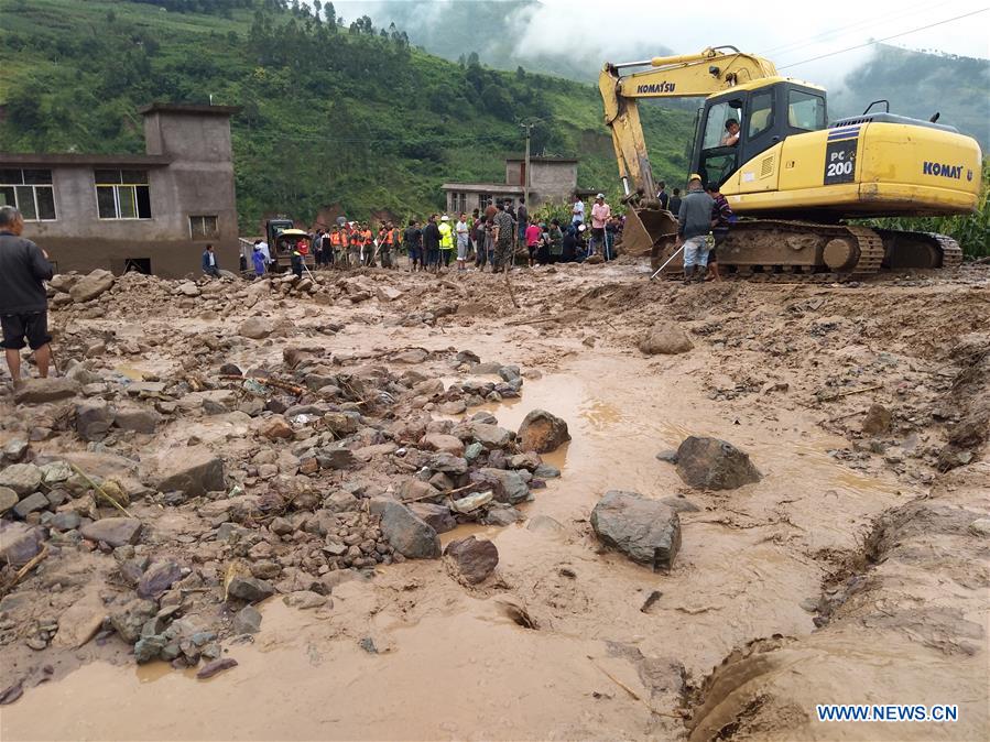 Rescuers work at the accident site after a rain-triggered landslide hit Gengdi Village in Qiaowo Town of Puge County, southwest China's Sichuan Province, Aug. 8, 2017. [Photo: Xinhua]