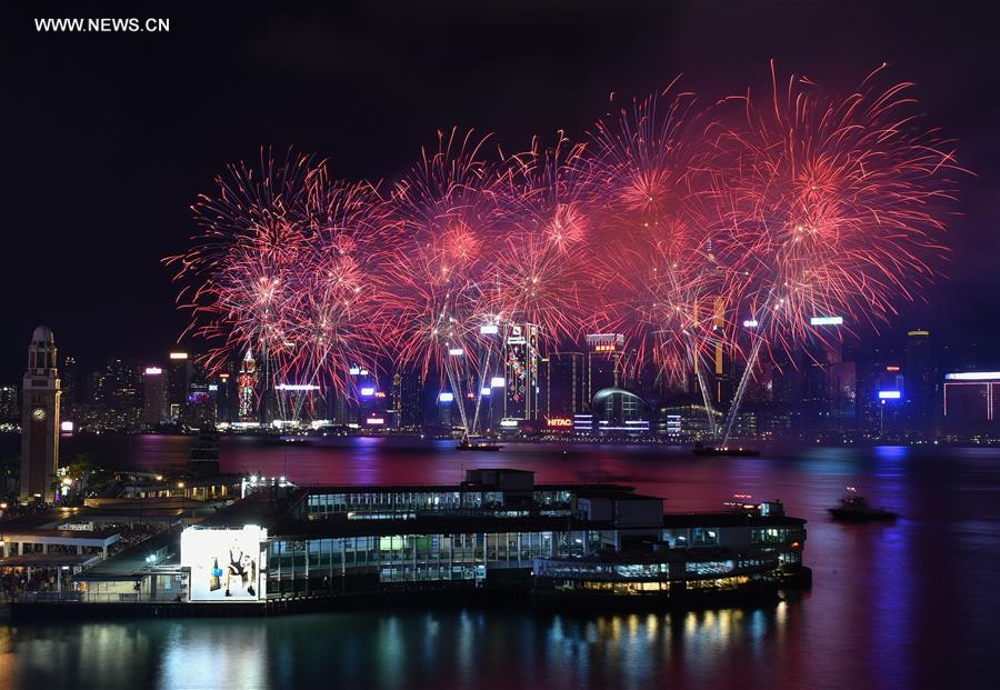 Fireworks illuminate the sky over the Victoria Harbour in Hong Kong, south China, Feb. 9, 2016, to celebrate the traditional Spring Festival. [Photo: Xinhua/Ng Wing Kin]