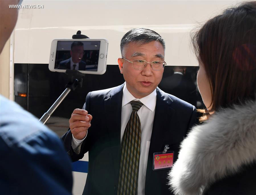 Si Fuchun, a member of the 12th National Committee of the Chinese People's Political Consultative Conference (CPPCC) from central China's Henan Province, receives an interview after he arrives in Beijing, capital of China, March 1, 2017, for the Fifth Session of the 12th CPPCC National Committee. [Photo: Xinhua/Zhang Duo]