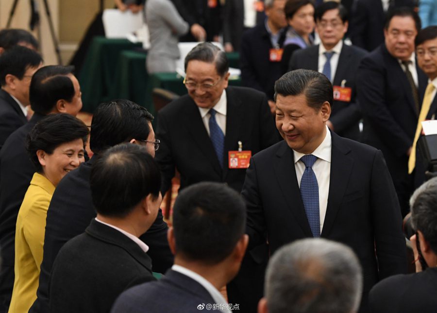 Chinese President Xi Jinping join political advisors from three Chinese non-Communist parties in a panel discussion in Beijing on March 4, 2017. [Photo: Xinhua]
