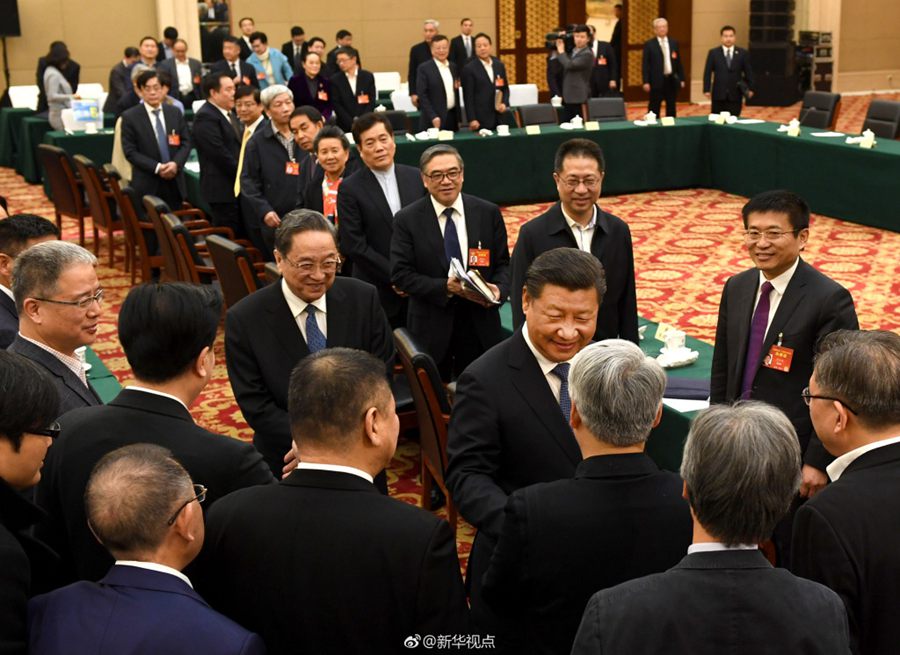 Chinese President Xi Jinping join political advisors from three Chinese non-Communist parties in a panel discussion in Beijing on March 4, 2017. [Photo: Xinhua]