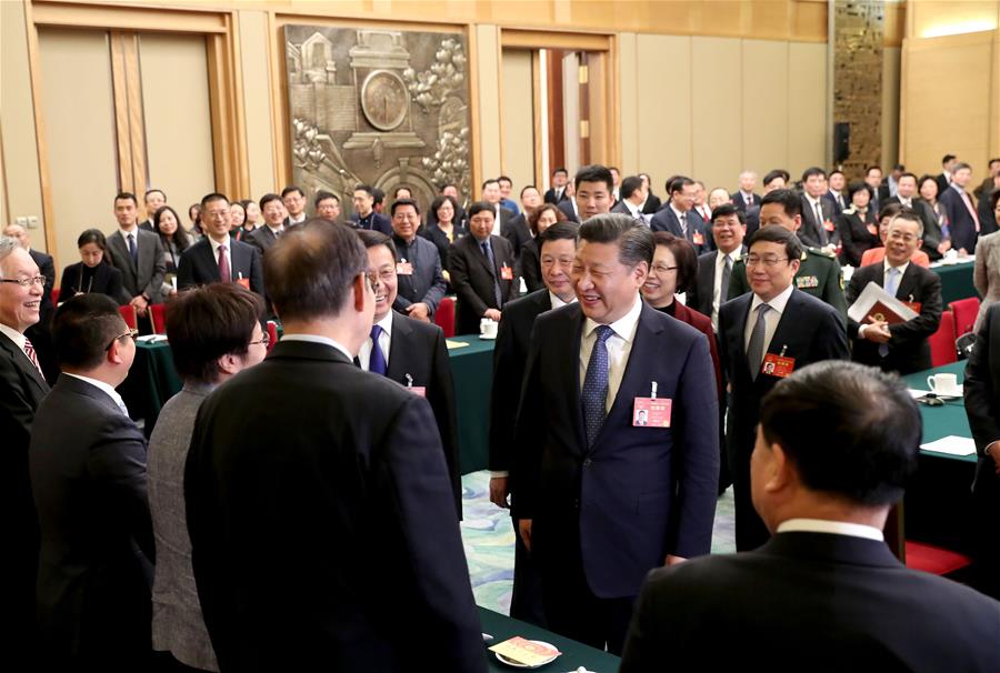 Chinese President Xi Jinping joins a panel discussion with deputies to the 12th National People's Congress (NPC) from Shanghai Municipality at the annual session of the NPC in Beijing, capital of China, March 5, 2017. [Photo: Xinhua]