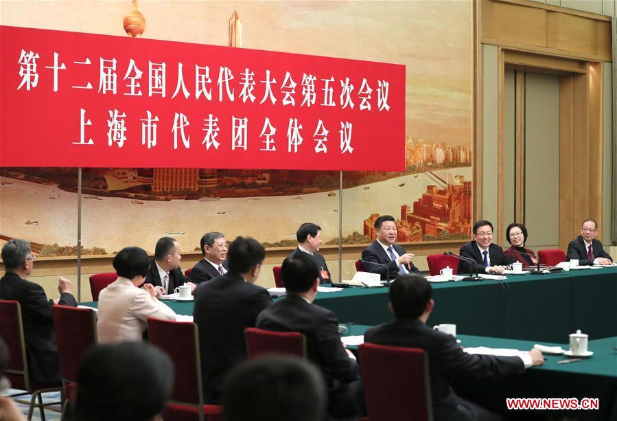 Chinese President Xi Jinping joins a panel discussion with deputies to the 12th National People's Congress (NPC) from Shanghai Municipality at the annual session of the NPC in Beijing, capital of China, March 5, 2017. [Photo: Xinhua]