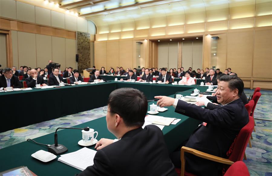 Chinese President Xi Jinping joins a panel discussion with deputies to the 12th National People's Congress (NPC) from Shanghai Municipality at the annual session of the NPC in Beijing, capital of China, March 5, 2017. [Photo: Xinhua]