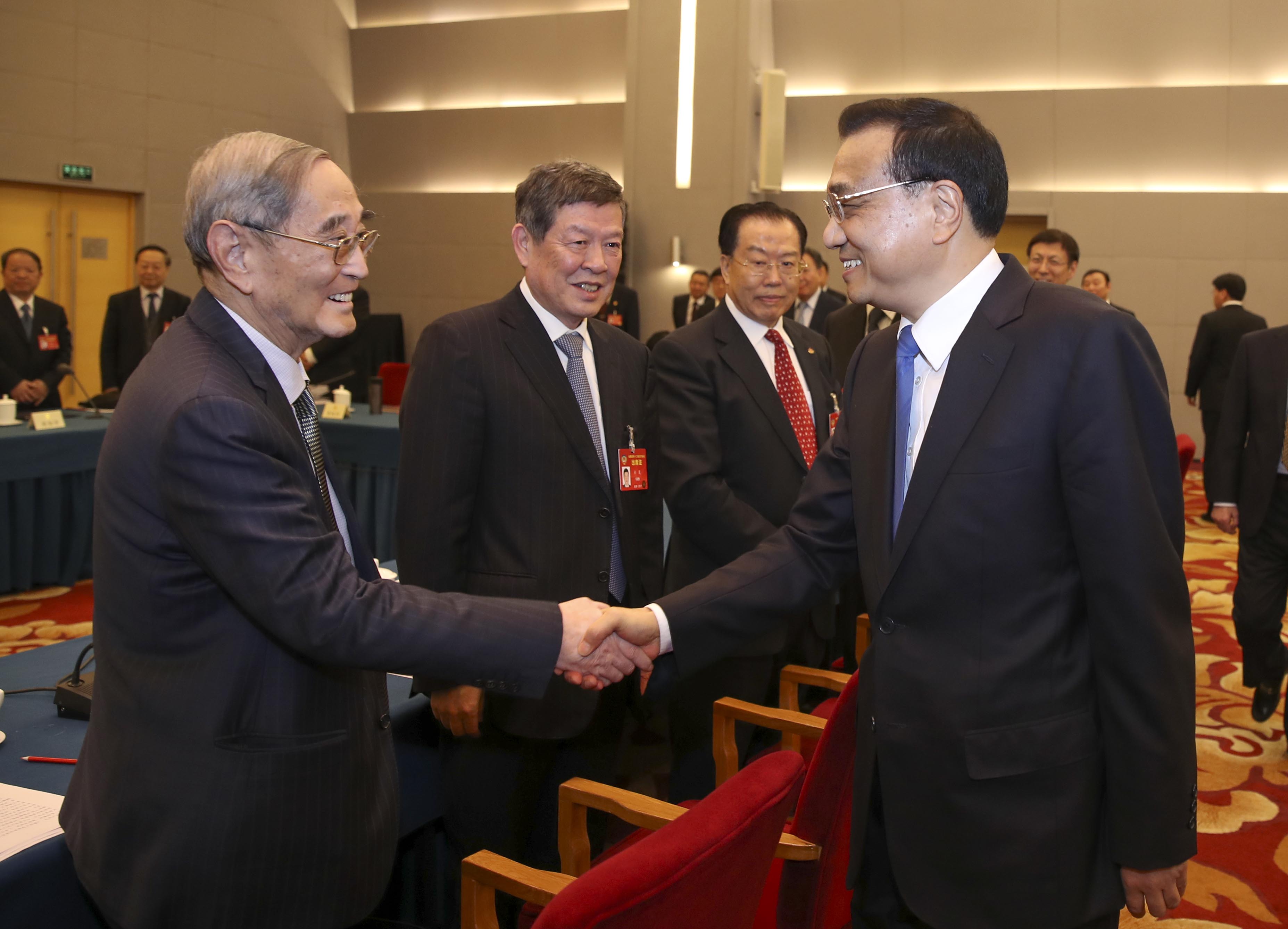 Premier Li Keqiang visiting members from business and agricultural communities attending the Fifth Session of the 12th National Committee of the Chinese People's Political Consultative Conference (CPPCC) on Saturday, March 04, 2017. Li participated in the joint discussion of the CPPCC members and listened to their opinions and proposals on property rights protection, prices of agricultural products, and the development of the private economy. [Photo: China Plus]