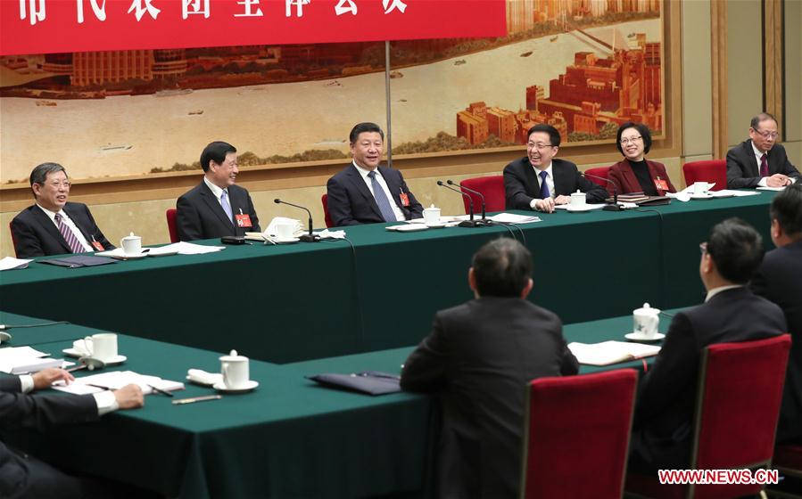 Chinese President Xi Jinping joins a panel discussion with deputies to the 12th National People's Congress (NPC) from Shanghai Municipality at the annual session of the NPC in Beijing, capital of China, March 5, 2017. [Photo: Xinhua]