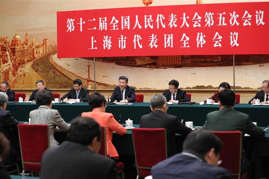 Chinese President Xi Jinping joins a panel discussion with deputies to the 12th National People's Congress (NPC) from Shanghai Municipality at the annual session of the NPC in Beijing, capital of China, March 5, 2017. [Photo: Xinhua]