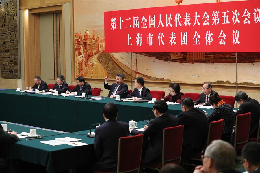 Chinese President Xi Jinping joins a panel discussion with deputies to the 12th National People's Congress (NPC) from Shanghai Municipality at the annual session of the NPC in Beijing, capital of China, March 5, 2017. [Photo: Xinhua]