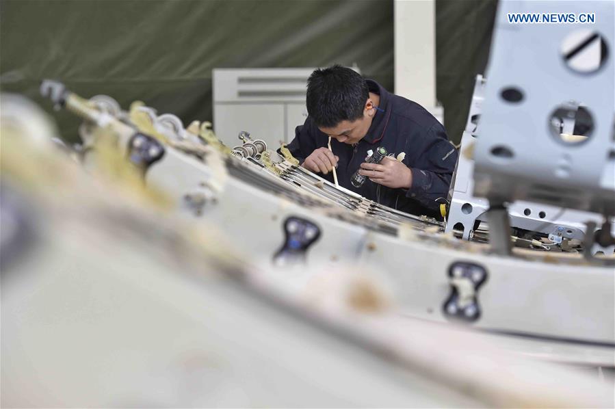 A man works at the workshop of Avic Chengfei Commercial Aircraft Co.,Ltd. in Chengdu, capital of southwest China's Sichuan Province, March 3, 2017. The Avic Chengfei Commercial Aircraft Co.,Ltd. successfully delivers one front door and 3,000 rear doors of A320 to Airbus Company recently. [Photo: Xinhua/Liu Kun]