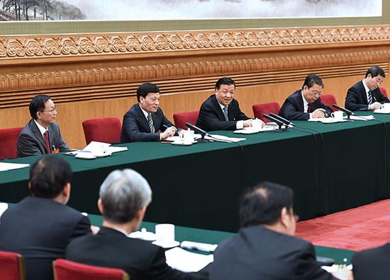 Liu Yunshan, a member of the Standing Committee of the Political Bureau of the Communist Party of China (CPC) Central Committee, attends a panel discussion with lawmakers from Henan at the ongoing annual session of the National People's Congress (NPC) on Mar 12, 2017. [Photo: Xinhua]