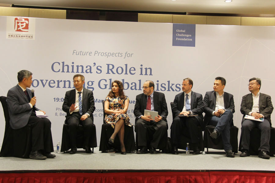 A panel discussion is held during a forum in Beijing talking about the most urgent global risks and China's role in global governance on Tuesday, March 14, 2017. [Photo: China Plus / Zhang Jin]