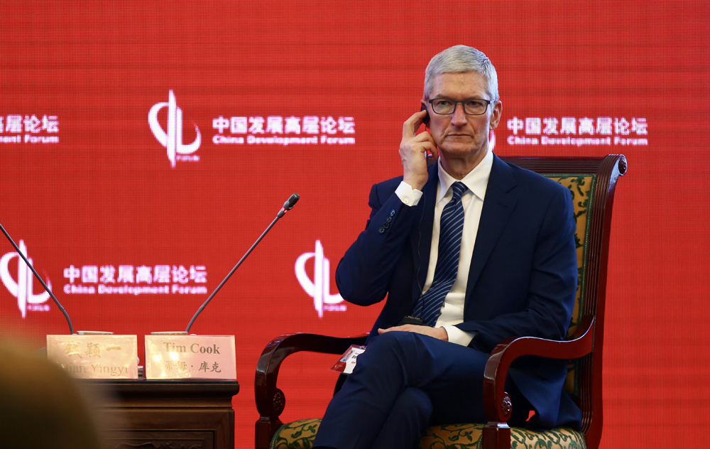 Apple CEO Tim Cook (right) speaks at the 18th China Development Forum (CDF) in Beijing on March 18, 2017. [Photo: China Plus/Li Jin]