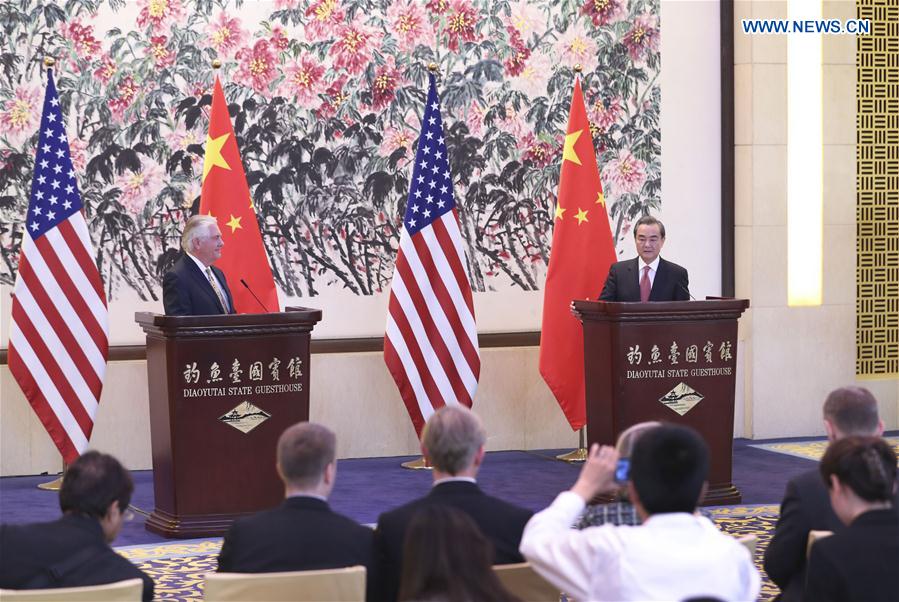Chinese Foreign Minister Wang Yi (R) and U.S. Secretary of State Rex Tillerson meet the press after their talks in Beijing, capital of China, March 18, 2017. [Photo: Xinhua]