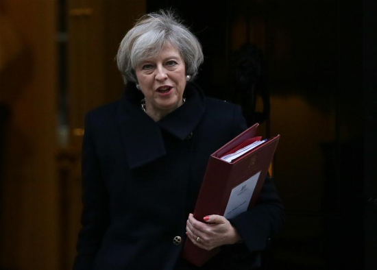 British Prime Minister Theresa May leaves 10 Downing Street for Prime Minister's questions at the House of parliament in London, Britain, Feb. 8, 2017. [Photo: Xinhua/Tim Ireland]