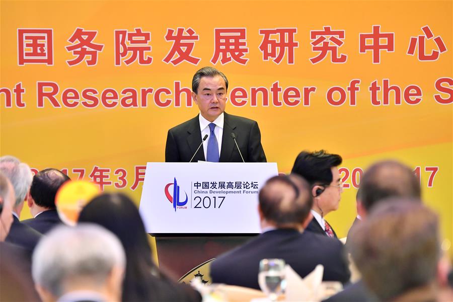 Chinese Foreign Minister Wang Yi delivers a speech at the China Development Forum 2017 in Beijing, capital of China, March 20, 2017. [Photo: Xinhua]