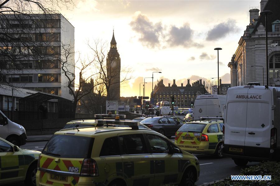 Ambulances and police vehicles are seen near the Houses of Parliament, in London, Britain on March 22, 2017. Four people have been killed, including the stabbed officer and a male terrorist, and at least 20 injured in an attack on the Houses of Parliament Wednesday afternoon in a terrorist attack, police announced. [Photo: Xinhua]