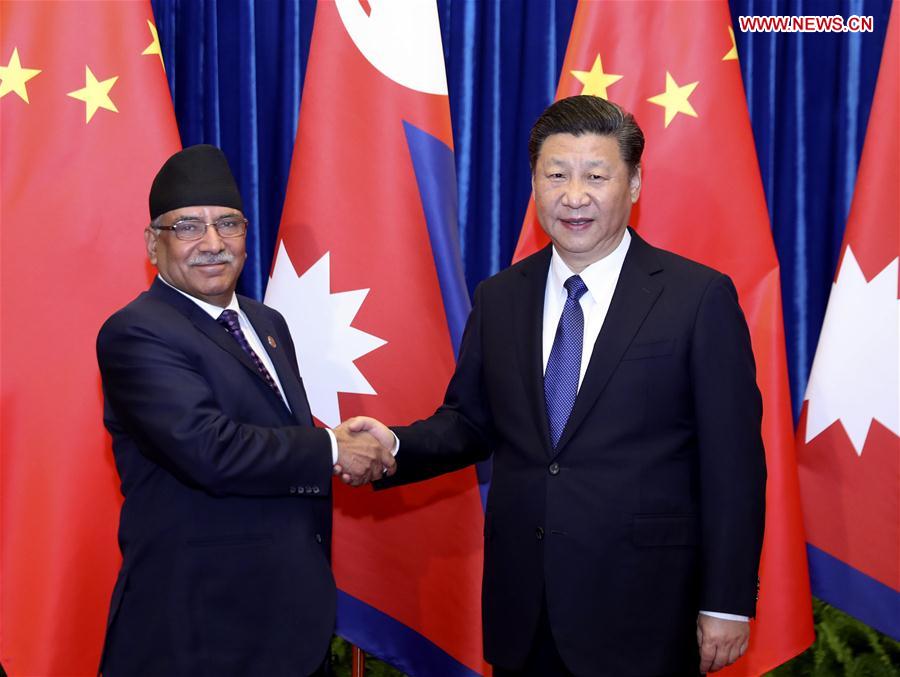 Chinese PresidentXi Jinping(R) meets with Nepali Prime Minister Pushpa Kamal Dahal in Beijing, capital of China, March 27, 2017. [Photo: Xinhua]