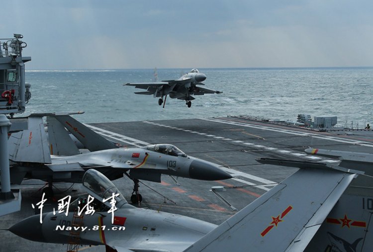 A J-15 carrier-borne fighter jet is landing on aircraft carrier Liaoning during a training mission in the Yellow Sea on December 23, 2016. A naval formation consisting of aircraft carrier Liaoning, several destroyers and frigates was on training and testing missions last week, military sources said on Saturday. [Photo: Navy.81.cn] 