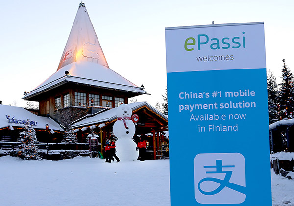 Alipay lands in the Santa Claus village in Arctic Circle, Finland, in December, 2016, signaling the first-ever mobile payment solution available in Finland. [Photo: China Daily]
