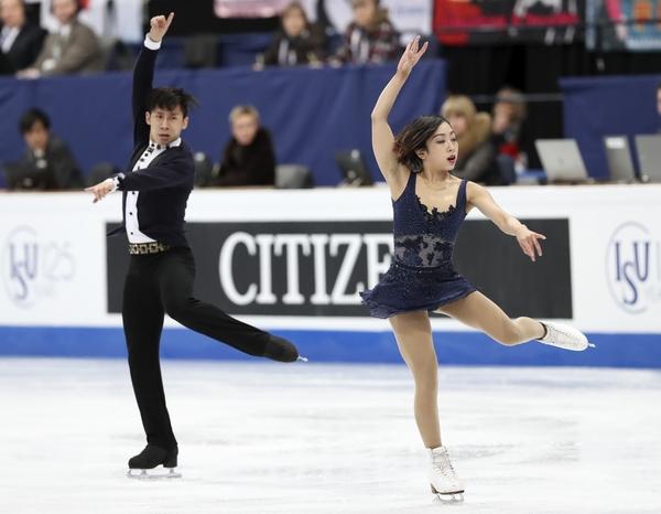 Sui Wenjing and Han Cong win gold at the Figure Skating World Championships in Finland. [Photo: China Daily]