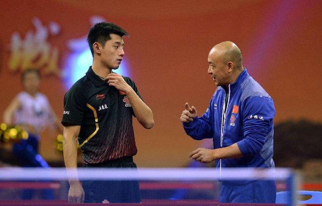 File photo shows Zhang Jike (L) and his former coach Xiao Zhan. [Photo: sina.com.cn]