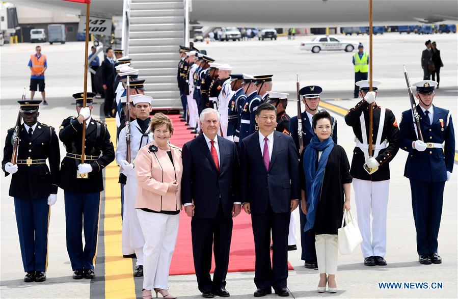 Chinese President Xi Jinping (2nd R, front) and his wife Peng Liyuan (1st R, front) are welcomed by U.S. Secretary of State Rex Tillerson (2nd L, front) and his wife upon their arrival at Palm Beach International Airport in Florida, the United States, April 6, 2017. [Photo: Xinhua/Wu Xiaoling]