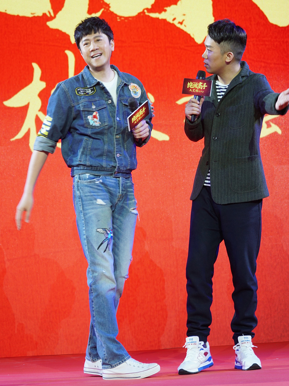 Veteran singer Cai Guoqing (left) and film director Lu Zhenyu (right) attend a promotional event in Beijing on Thursday afternoon, April 6, 2017 for their new film project The One.[Photo: provided to China Plus]