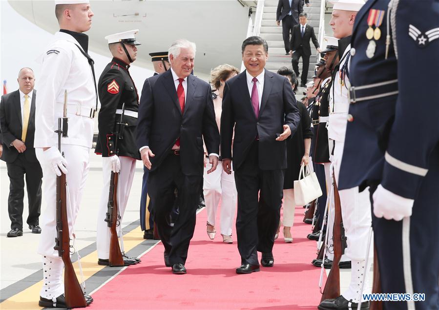 Chinese President Xi Jinping and his wife Peng Liyuan are welcomed by U.S. Secretary of State Rex Tillerson and his wife upon their arrival at Palm Beach International Airport in Florida, the United States, April 6, 2017.[Photo: Xinhua/Lan Hongguang]