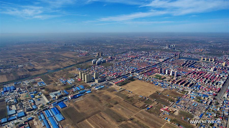Aerial view of Xiongxian County, north China's Hebei Province. The New Area, about 100 km southwest of downtown Beijing, will span three counties that sit at the center of the triangular area formed by Beijing, Tianjin and Hebei's provincial capital Shijiazhuang. [Photo: Xinhua]
