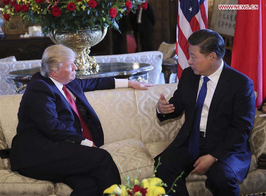 Chinese President Xi Jinping (R) meets with his U.S. counterpart Donald Trump in the latter's Florida resort of Mar-a-Lago in the United States, April 6, 2017. [Photo: Xinhua/Lan Hongguang]