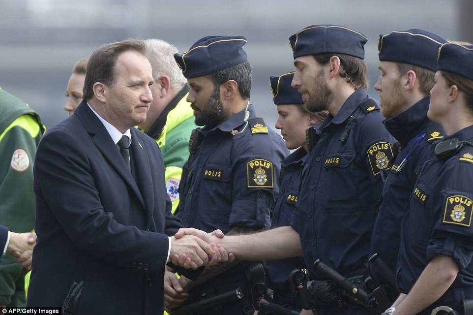 Prime Minister Stefan Lofven took part in a vigil outside city hall, hours after vowing that 'terrorists will never defeat Sweden'. [Photo: EPA]