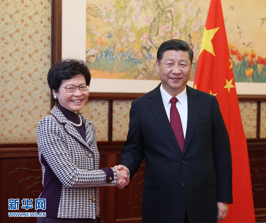 President Xi Jinping congratulates Lam Cheng Yuet-ngoron her victory in the election as Hong Kong's fifth-term chief executive in Beijing on Apr. 11, 2017. [Photo: Xinhua]