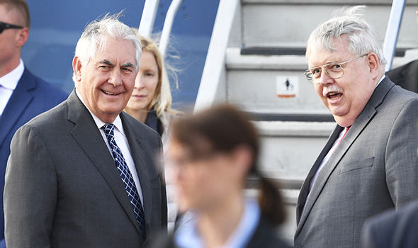 Tillerson speaks with US Ambassador to Russia John F Tefft. [Photo: Getty]