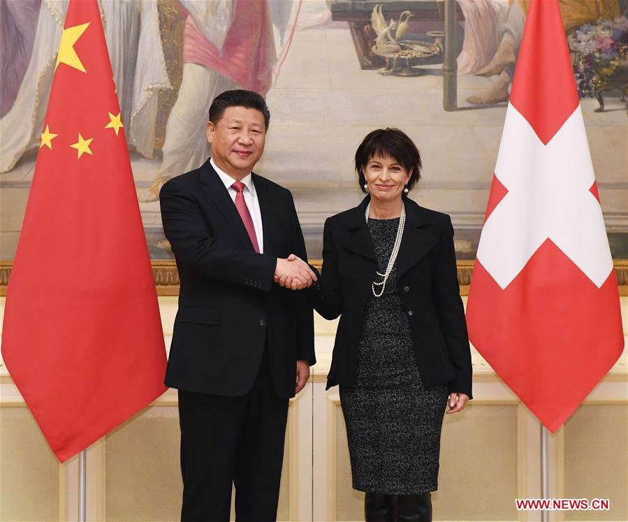 Chinese President Xi Jinping (L) shakes hands with his Swiss counterpart Doris Leuthard in Bern, Switzerland, Jan. 16, 2017. [Photo: Xinhua/Rao Aimin]