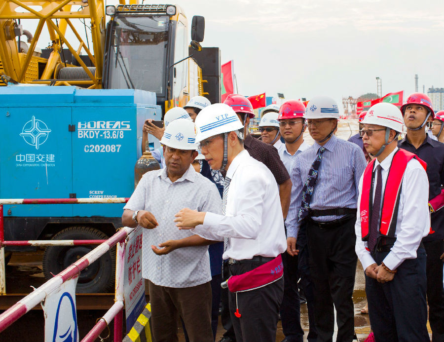 Maldivian President Abdulla Yameen (left) inspects the construction site of the China-Maldives Friendship Bridge in December 2016. [Photo:Sasac.gov.cn]