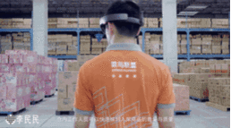 A worker scan bar codes on parcels with the help of AR glasses, in a warehouse [Photo: sohu.com]
