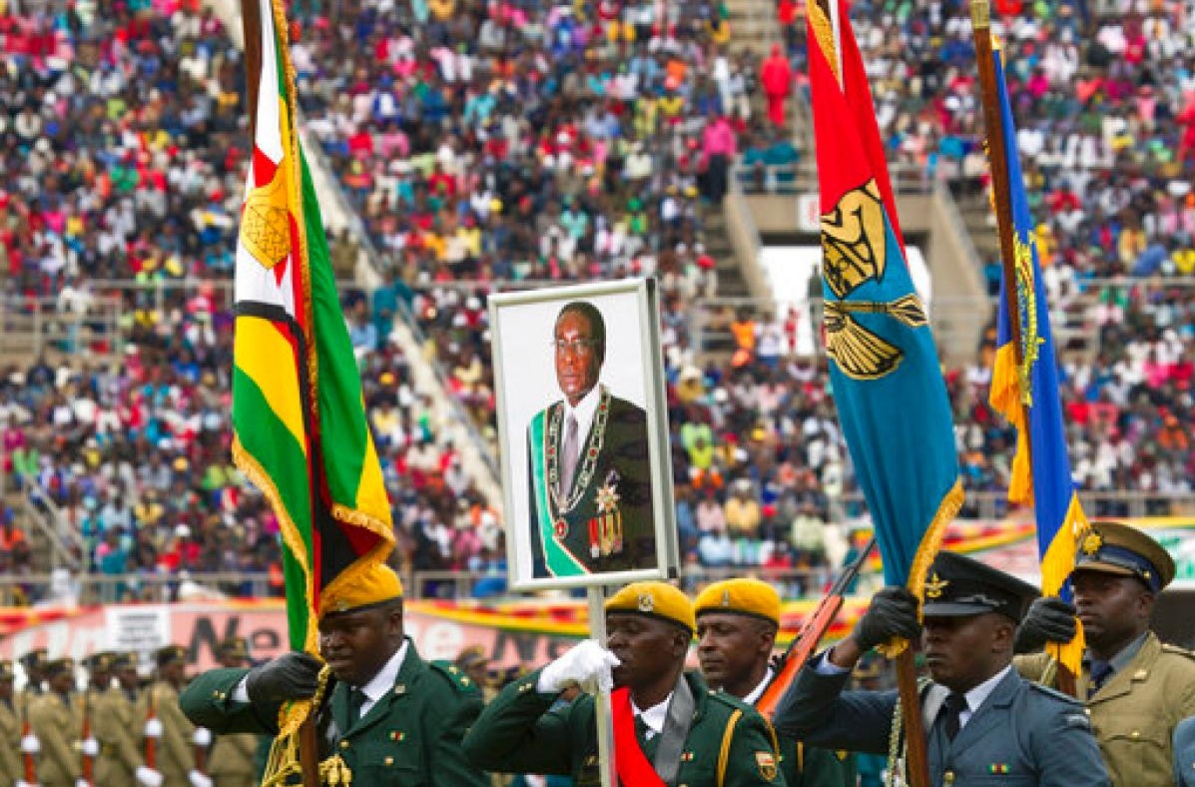 Soldiers carry Zimbabwe's President Robert Mugabe's portrait during the country's 37th Independence celebrations in Harare, Tuesday, April, 18, 2017. Zimbabwe is celebrating 37 years of Independence from British colonial rule with the ruling Zanu Pf party calling on patriots to uphold and cherish the values that informed the liberation struggle.[Photo: AP]