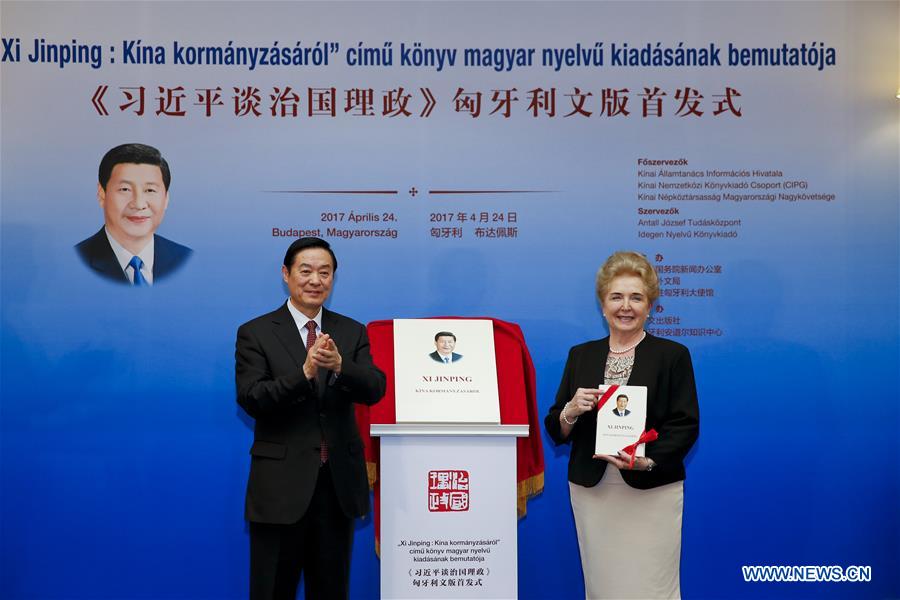 Liu Qibao (L), member of the Political Bureau of the Central Committee of the Communist Party of China (CPC) and head of the Publicity Department of the CPC Central Committee, and Matrai Marta, executive vice chairman of the Hungarian National Assembly, attend the release ceremony of the Hungarian version of Chinese President Xi Jinping's book "Xi Jinping: the Governance of China" in Budapest, Hungary, on April 24, 2017. [Photo: Xinhua/Ye Pingfan]