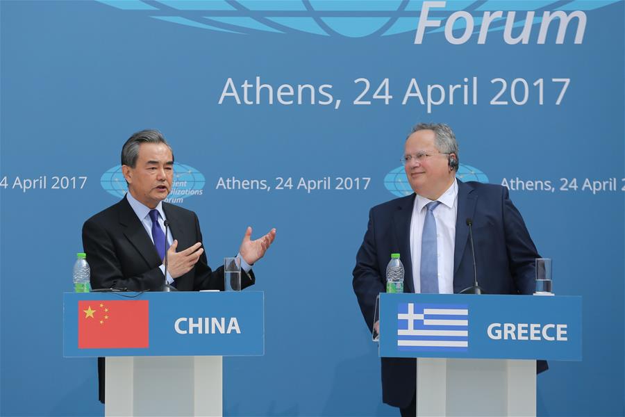 Chinese Foreign Minister Wang Yi (L) and Greek Foreign Minister Nikos Kotzias attend the first ministerial meeting of the Ancient Civilization Forum in Athens, Greece, on April 24, 2017. [Photo: Xinhua]