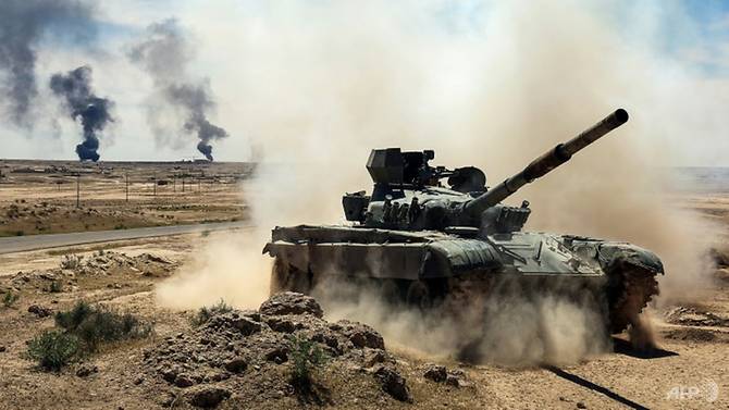 An Iraqi-modified T-72M tank belonging to the pro-government Hashed al-Shaabi paramilitary forces advances on Apr 26, 2017 towards the ancient city of Hatra, southwest of Mosul, during an offensive to retake the area from the Islamic State group. (Photo: AFP/Read more at http://www.channelnewsasia.com/news/world/iraqi-forces-seize-ancient-site-of-hatra-from-is-8794820