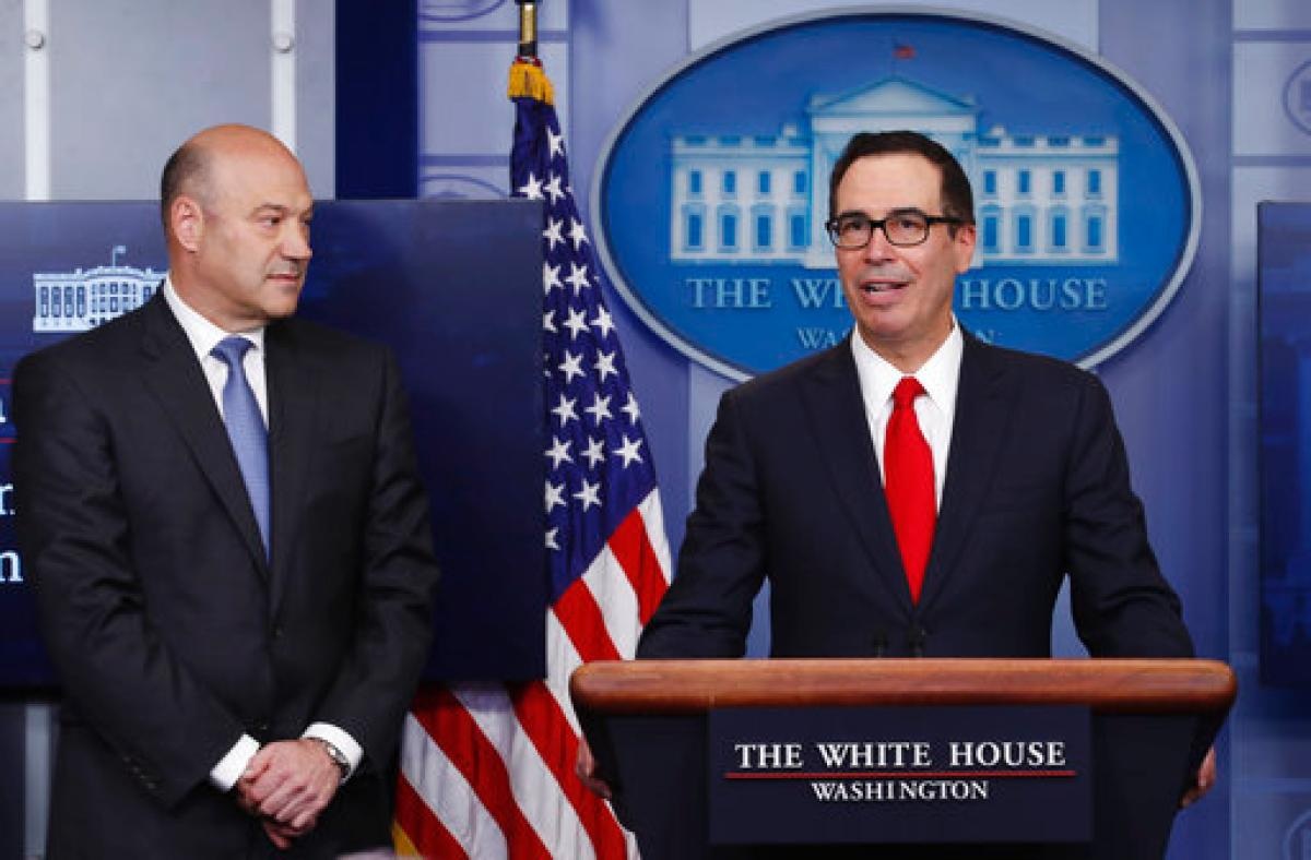 Treasury Secretary Steven Mnuchin, joined by National Economic Director Gary Cohn, speaks in the briefing room of the White House in Washington, Wednesday, April 26, 2017. President Donald Trump is proposing dramatically reducing the taxes paid by corporations big and small in an overhaul his administration says will spur economic growth and bring jobs and prosperity to the middle class. (AP