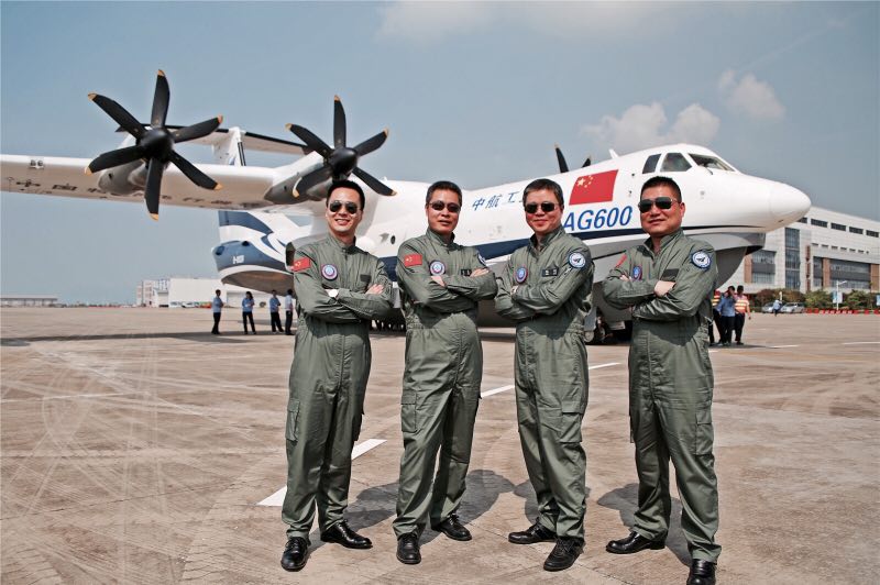 Test pilots pose with the amphibious aircraft AG600 in Zhuhai, south China's Guangdong province, on Saturday, April 29, 2017. [Photo: China Plus/Li Jin]