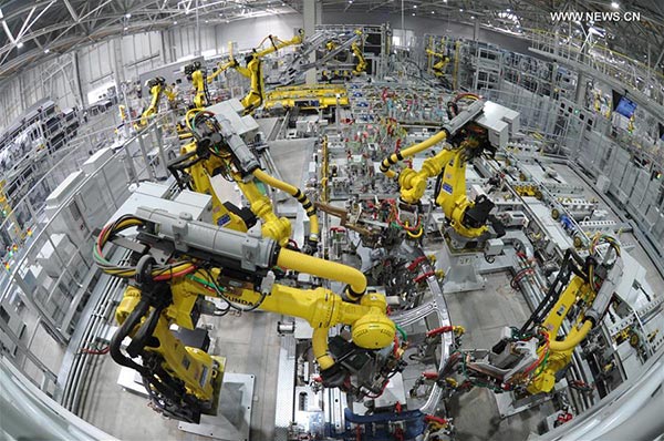 Robots work on a production line at a car factory in Cangzhou city, north China's Hebei Province, Oct. 18, 2016. [Photo: Xinhua]