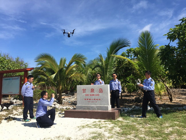Chinese marine law enforcement personnel use a drone to patrol one of the Xisha islands in the South China Sea, in April 2017. [Photo: scsb.gov.cn]