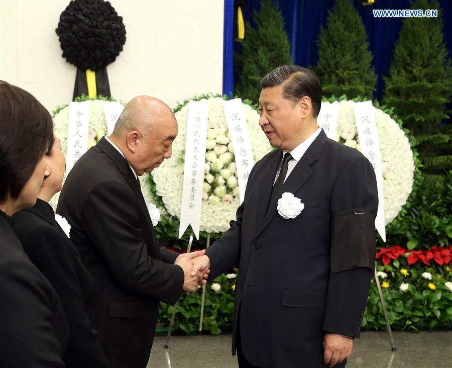Chinese President Xi Jinping (R) shakes hands with a family member of Buhe, a former vice chairman of the Standing Committee of the National People's Congress (NPC), at the funeral of Buhe at the Babaoshan Revolutionary Cemetery in Beijing, capital of China, May 11, 2017. The cremation of Buhe was held Thursday in Beijing. Buhe died in Beijing on May 5. He was 91. President Xi Jinping, Premier Li Keqiang, and other senior leaders including Zhang Dejiang, Yu Zhengsheng, Liu Yunshan, Wang Qishan and Zhang Gaoli, as well as former leader Hu Jintao attended the funeral. [Photo: Xinhua]