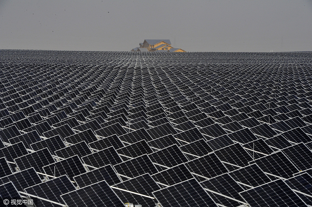 Miles of photovoltaic panels are seen in a suburb in Yinchuan, Ningxia Hui Autonomous Region. There's a growing divide in energy policies between China, the UK and the EU on one side, and the USA on the other. [Photo: VCG]