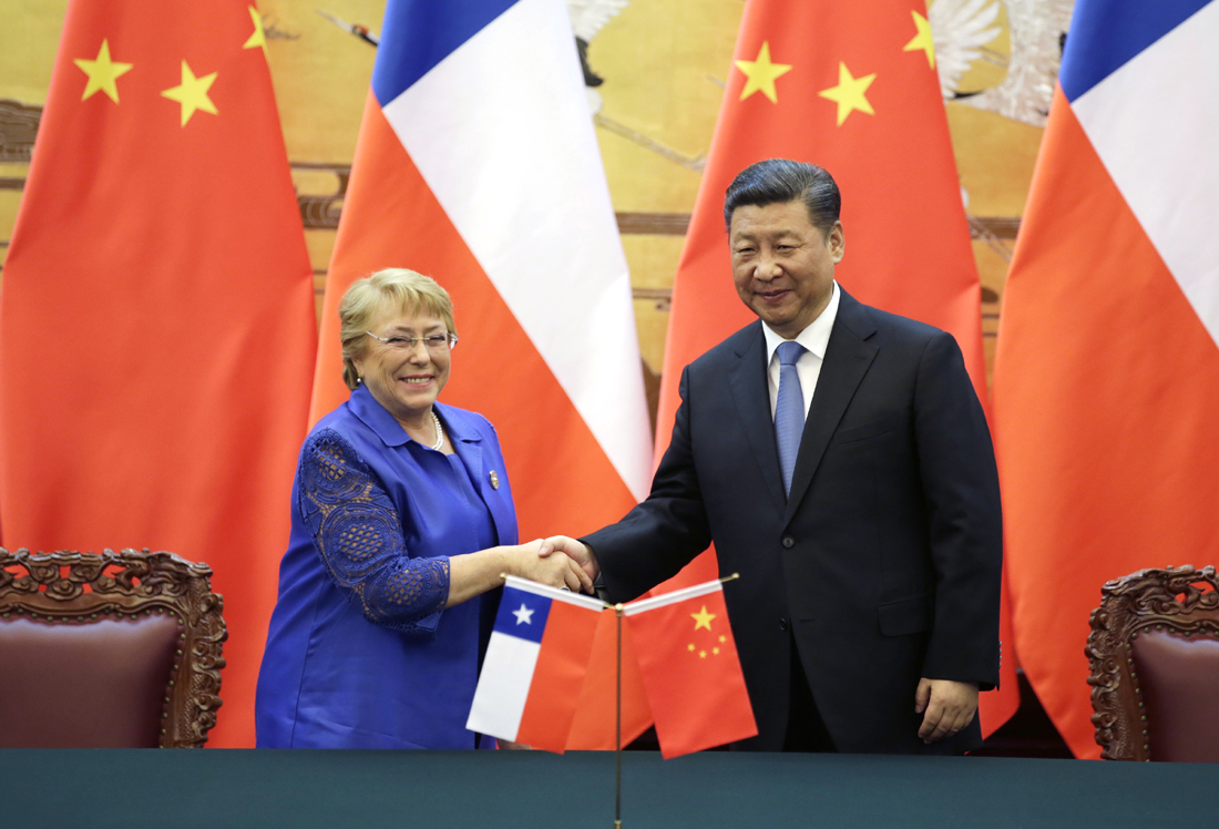 Chilean President Michelle Bachelet, poses with Chinese President Xi Jinping for a photo during asigning ceremony ahead of the Belt and Road Forum in Beijing Saturday, May 13, 2017. [Photo: Pool Photo via AP/Jason Lee]