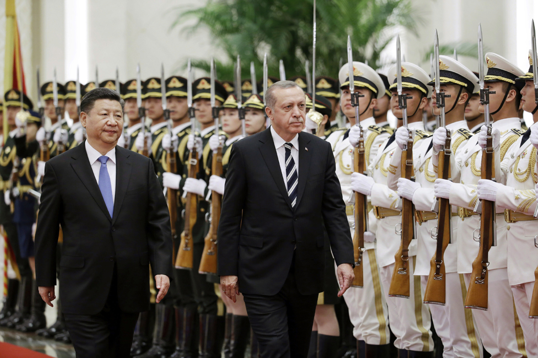 Chinese President Xi Jinping,, left and Turkish President Recep Tayyip Erdogan address the honour guard, ahead of the Belt and Road Forum in Beijing, Saturday, May 13, 2017. [Photo: Pool Photo via AP/Jason Lee]