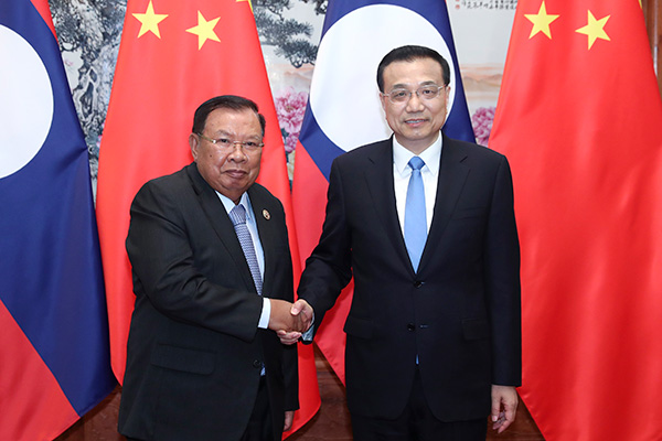 Premier Li Keqiang on May 13 met with Lao President Bounnhang Vorachit, who is in Beijing to attend the Belt and Road Forum for International Cooperation scheduled for May 14 to 15.[Photo:gov.cn]