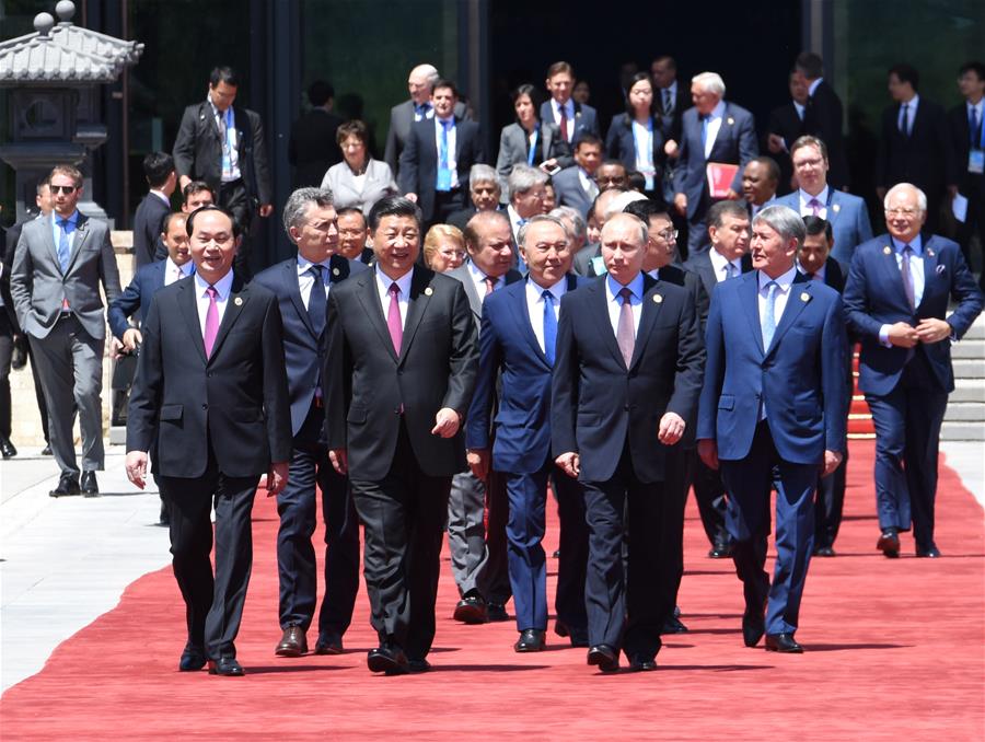 Chinese President Xi Jinping, foreign delegation heads and guests walk out of the Yanqi Lake International Convention Center after the first session of the Leaders' Roundtable Summit at the Belt and Road Forum (BRF) for International Cooperation, in Beijing, capital of China, May 15, 2017. [Photo: Xinhua]